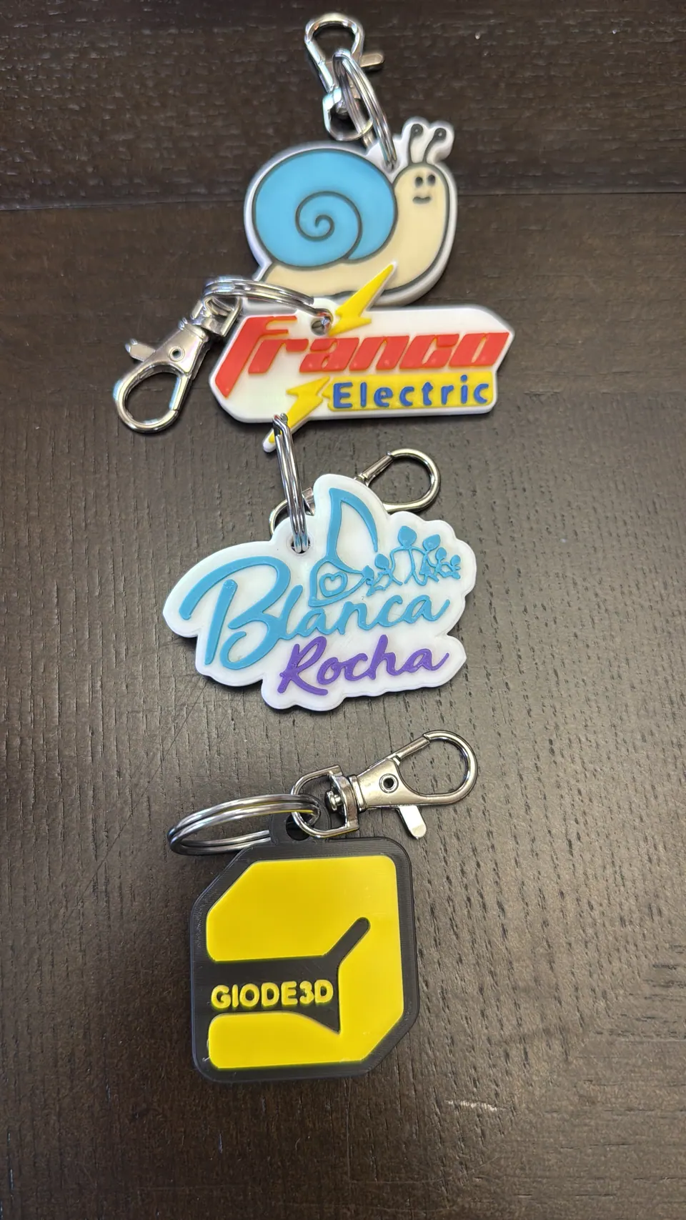Custom NFC keychains made by Giode3D: Franco Electric, Blanca Rocha