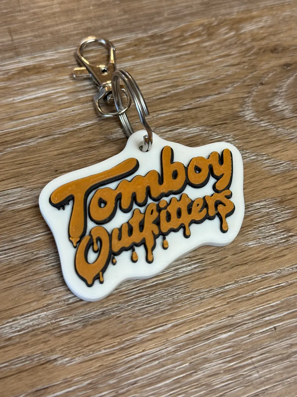 Custom NFC keychains made by Giode3D: Tomboy Outfitters
